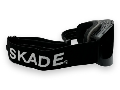 a pair of black and white sneakers with the word skade printed on them